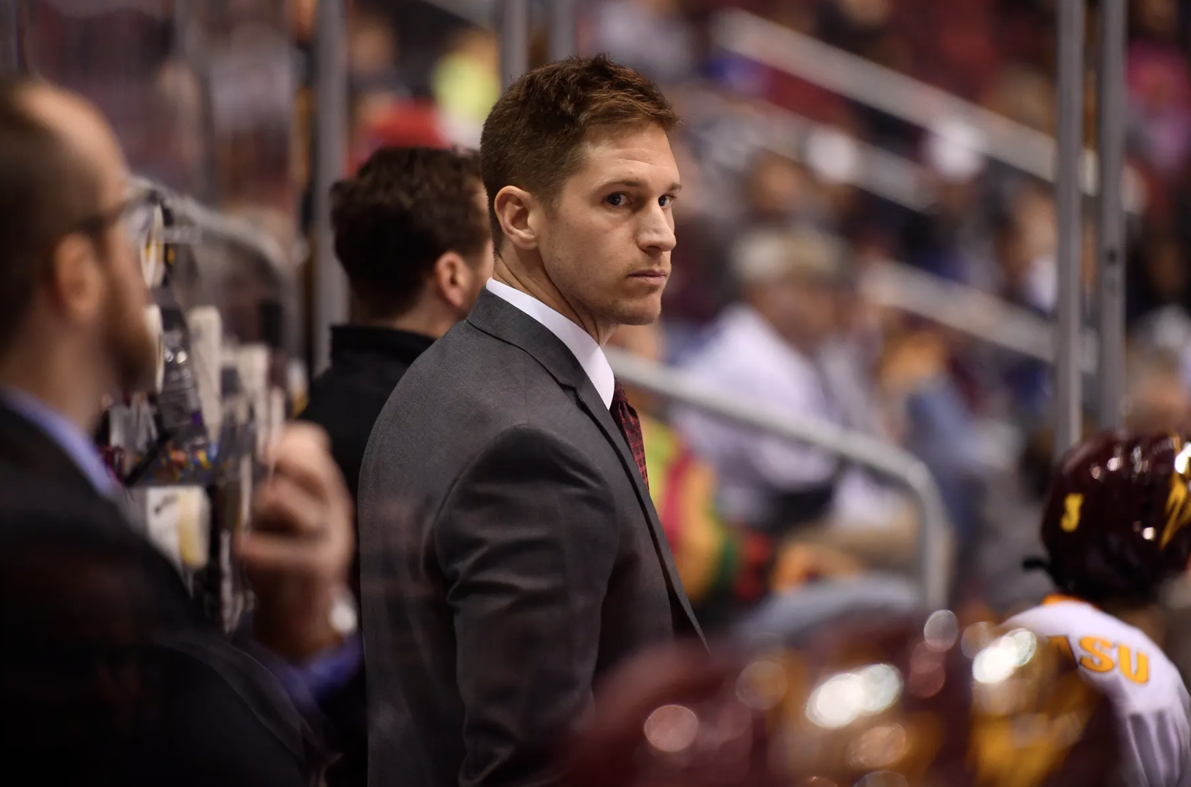 Mike Field on ASU hockey bench