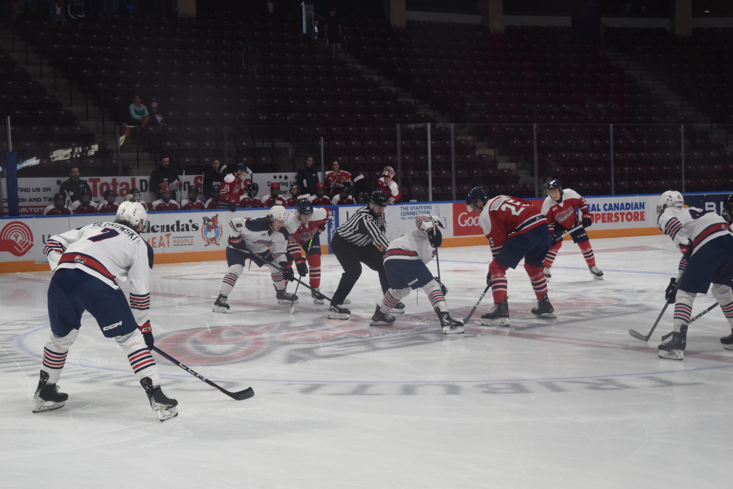 A photo of the opening face off for Scrimmage #2 between Team Andreychuk and Team Lindros.